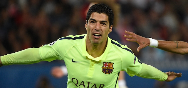 Barcelona's Uruguayan forward Luis Suarez celebrates after scoring during the UEFA Champions league quarter-final first leg football match PSG vs FC Barcelona at the Parc des Princes stadium in Paris on April 15, 2015. AFP PHOTO / MARTIN BUREAU (Photo credit should read MARTIN BUREAU/AFP/Getty Images)