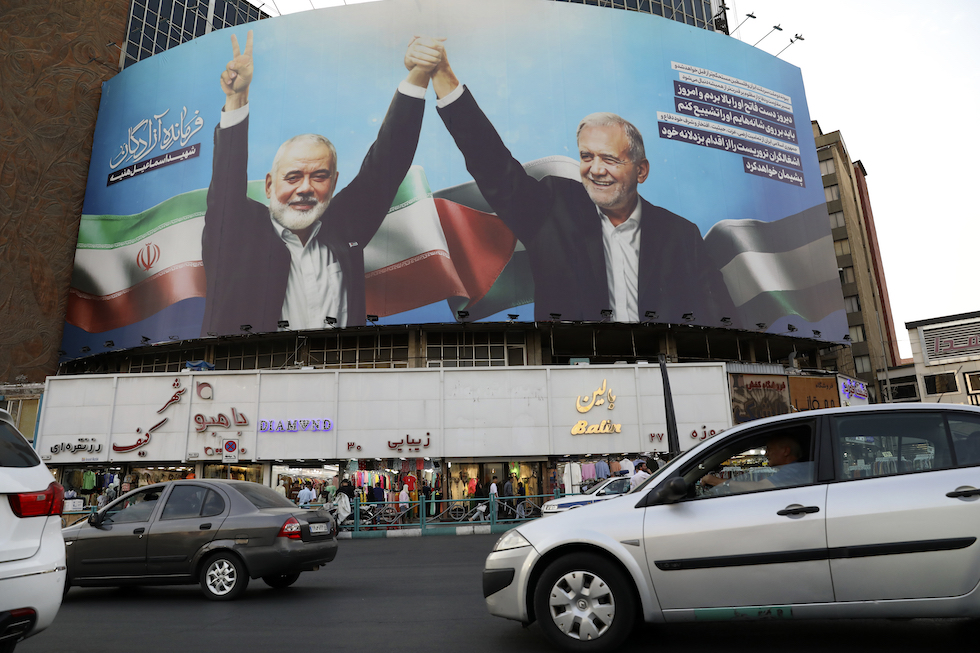 A large poster in Tehran shows Pezeshkian and Hamas political leader Ismail Haniyeh, who were likely killed by Israel.